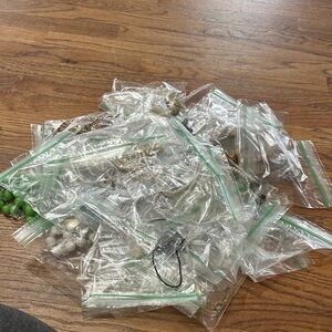 Mystery jewelry batch. Individually bagged to avoid tangles unlike in the jars.